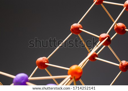 Children's game building construction with toothpick sticks and plasticine balls close up still