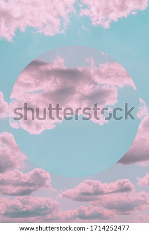 Aesthetic art collage with beautiful turquoise sky with pink clouds and mirror reflection in circle frame. Angel paradise concept