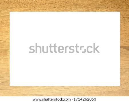 White paper placed on a square wooden background