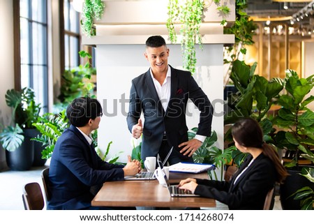 Multiethnic Business people busy working together on business project in modern office. Brainstorming, analyze and discussion concept. Co working space. Professional business team