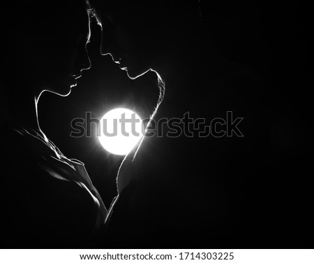 Silhouette a happy couple holding each other. Couple in love. Shadow. Man and woman posing studio. Heart. Valentine day. Lovers. Background. Men. Guy. Beauty photo. Romantic lovers. Lovely. Face.
 Royalty-Free Stock Photo #1714303225