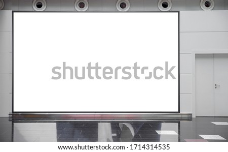Large blank mock up of horizontal street poster billboard on airport background with entrance door.