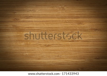 Scratched wooden background with vignette