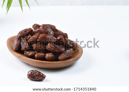 Kurma Tunisia
sweet dried date palm fruit in wooden plate ,isolated white background,eye level Royalty-Free Stock Photo #1714351840