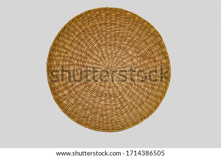 Wooden, straw, baskets, napkins, wicker patterns, handmade. top view isolate on over white background, close up. Decorative eco products. Royalty-Free Stock Photo #1714386505