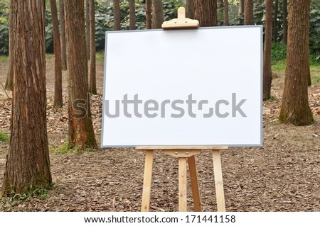 Blank drawing board in the woods