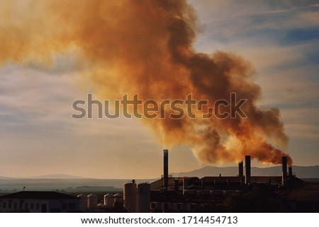 Power plant, smoke from the chimney. Air pollution environmental contamination, ecological disaster earth planet problems concept. Photo taken in Spain, Espana Royalty-Free Stock Photo #1714454713