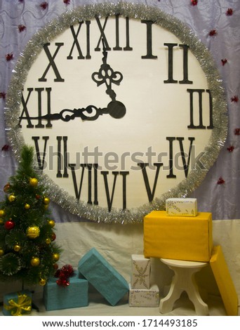 large interior clock with roman numerals with christmas tree