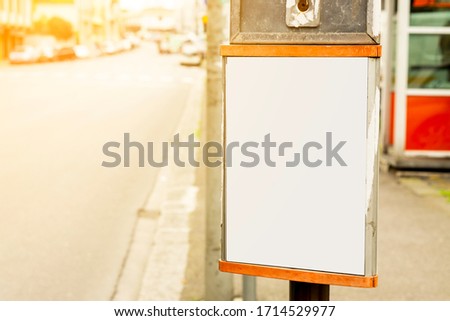 mock up blank space canvas of old rusted bus timeline schedule board, at bus stop in a suburban street area with tersest housing, board for advertisement adverts sale and marketing strategy discount 