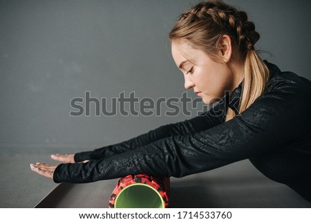 Caucasian female sportswoman stretching muscles in workout in pilates studio. Set photo with film photo gain.