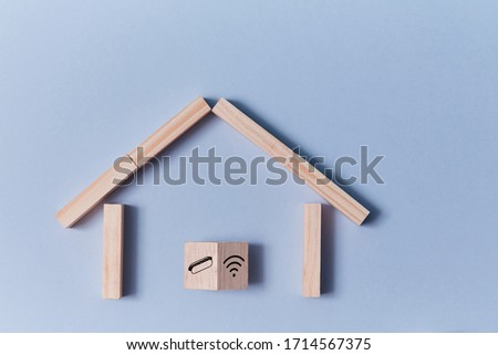 Online delivery service. Home food ordering. Wooden house of blocks and cube with hot dog and wifi sign, place for text