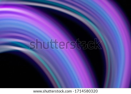 colorful neon light painting photography, long exposure, ripples and waves against on background.