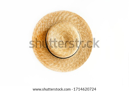 Flat lay of straw hat isolated on white background. Top view Royalty-Free Stock Photo #1714620724