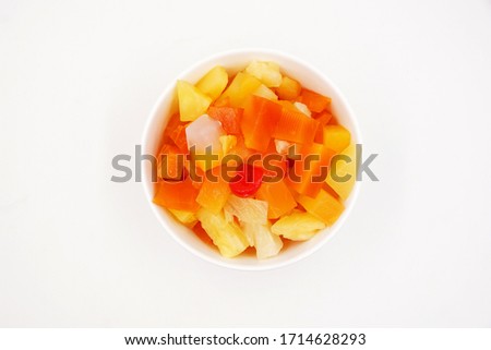 Canned fruit cocktail with pineapple, papaya, Nata de Coco and cherries 
 Royalty-Free Stock Photo #1714628293