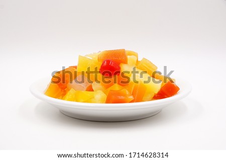 Canned fruit cocktail with pineapple, papaya, Nata de Coco and cherries 
 Royalty-Free Stock Photo #1714628314