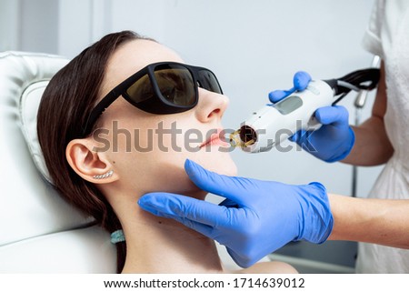 Skin Care. Young Woman Receiving Facial Beauty Treatment, Removing Pigmentation At Cosmetic Clinic. Intense Pulsed Light Therapy. IPL. Rejuvenation, Photo Facial Therapy. Anti-aging Procedures. Laser  Royalty-Free Stock Photo #1714639012