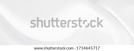 White gray satin texture that is white silver fabric silk panorama background with beautiful soft blur pattern natural. Royalty-Free Stock Photo #1714645717