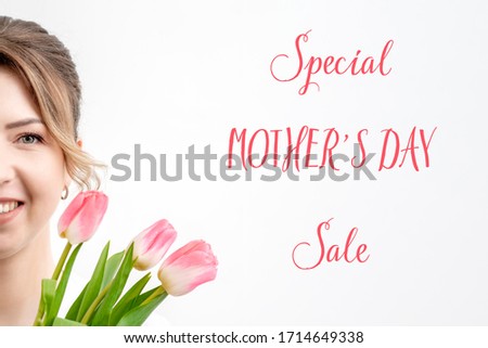 Special Mother's Day Sale pink text and smiling young woman with pink tulips on white background.