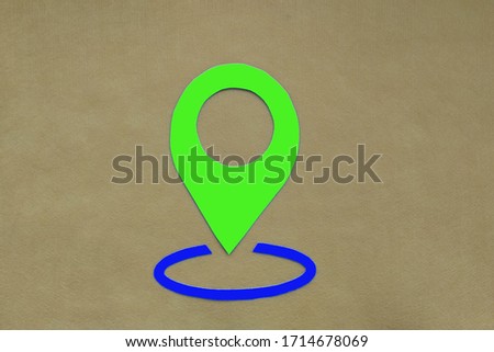 Geolocation sign on a light brown background. Location detection technology.