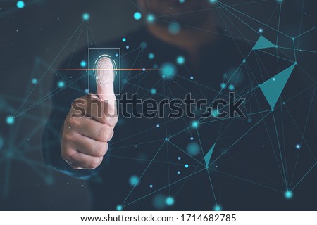 Business men use their thumbs to touch Fingerprint scanning system. Fingerprint scanner technology concept To verify identity. Royalty-Free Stock Photo #1714682785