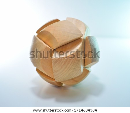 Wooden puzzle on a white background asssembled