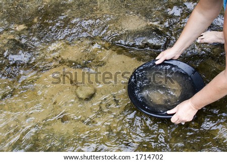 gold panning iin a small stream in northern michigan Royalty-Free Stock Photo #1714702