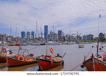 The view of the Montevideo skyline from Buceo Port Pier Harbor crowed of small fishing boats and ships along the Rio De La Plata, River Plate, Montevideo Uruguay, South America
