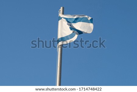 Israeli flag on background of cloudscape

