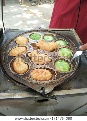 Jakarta - April 27 2020: Kue cubit is a Southeast Asian snack.The sellers of this snack usually operate near schools or traditional markets.