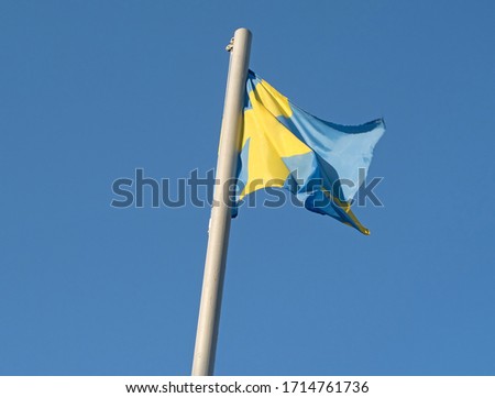 Flag of Sweden against blue sky
