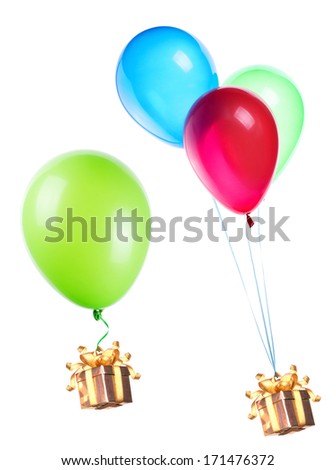 gift hanging on color balloons rising high