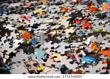 A pile of jigsaw puzzle pieces