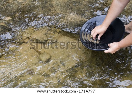 gold panning iin a small stream in northern michigan Royalty-Free Stock Photo #1714797