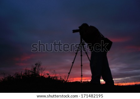 Photographer silhouette at sunset.