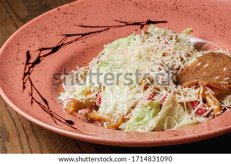 vegetable salad with meat sprinkled with cheese