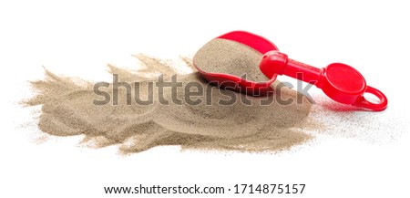 Plastic shovel, beach toy for kids in sand pile, isolated on white background Royalty-Free Stock Photo #1714875157