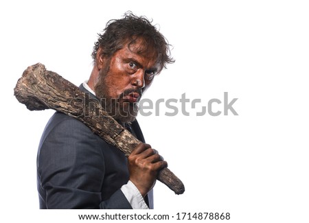 Caveman,ancient man businessman in suit Royalty-Free Stock Photo #1714878868