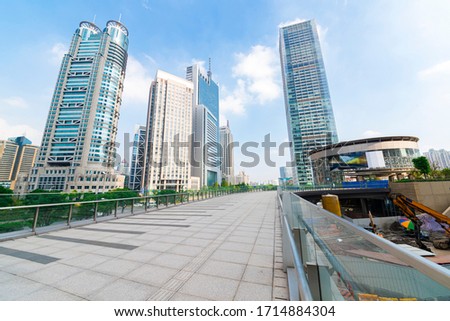 The pedestrian pavement under the tall building large building