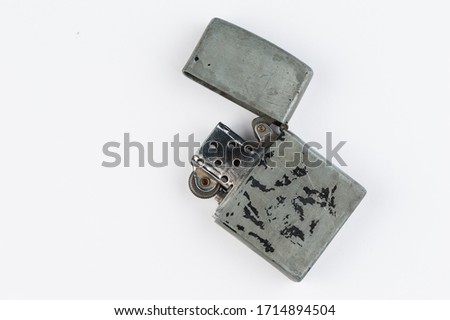 Old lighter isolated on white background. Metal style gasoline lighter .Copy space