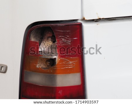 broken rear headlight of an old car