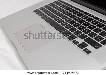 view of a laptop keyboard close up on white background	