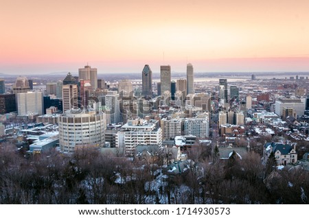 Beautiful winter sunset over downtown Montreal. Saint Lawrence river is visible in background.
