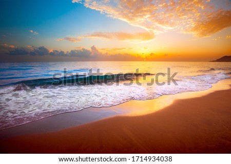 beautiful tropical sunset and sea Royalty-Free Stock Photo #1714934038