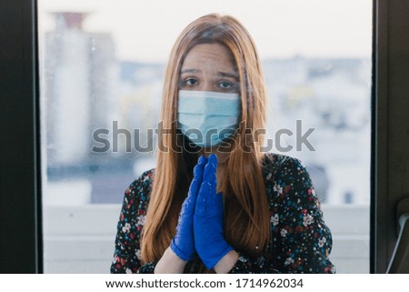 infected sick girl in a medical mask and medical gloves 2019-nCov. Coronavirus covid-19 concept. Pandemic global spread.