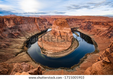 Horseshoe bend canyon giant stone loop panoramic view, looking down at Colorado river bend and red rock canyon, standing walls on the edge. Royalty-Free Stock Photo #1715005903