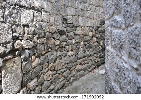 Texture of grey stone wall for background