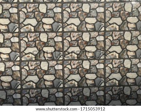 Compound wall tiles with printed design of small stones in random aggregates style for an residential building compound wall exterior decoration like an wallpaper