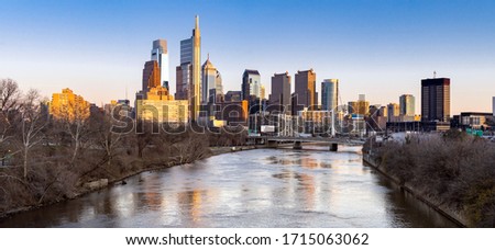 Panorama cityscape of Philadelphia skyscraper Skylines building sunset along river in Philly city downtown of Philadelphia in PA USA. Cityscape Urban lifstyle concept. Panoramic crop web banner.