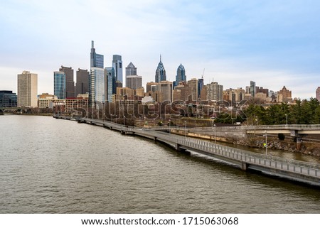 Cityscape of Philadelphia skyscraper Skylines building sunset with pedestrian walkway along river in Philly city downtown of Philadelphia in PA USA. Cityscape Urban lifstyle concept.