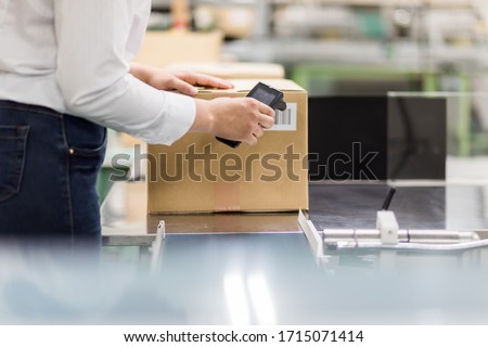 Young latina woman working in the warehouse. Royalty-Free Stock Photo #1715071414